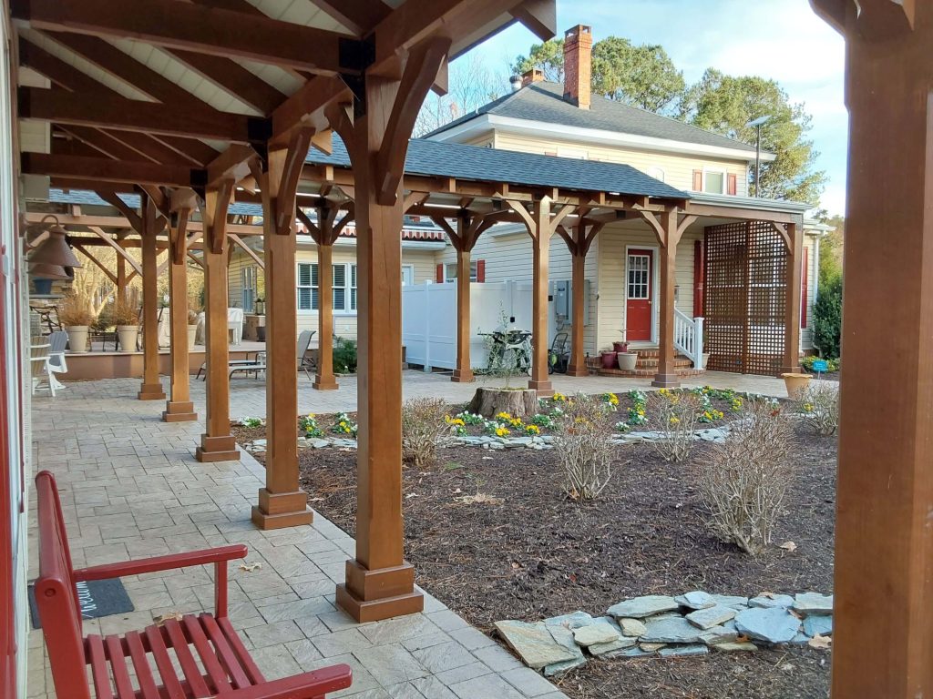 Left side of Guest house looking towards breezeway with new stained lattice