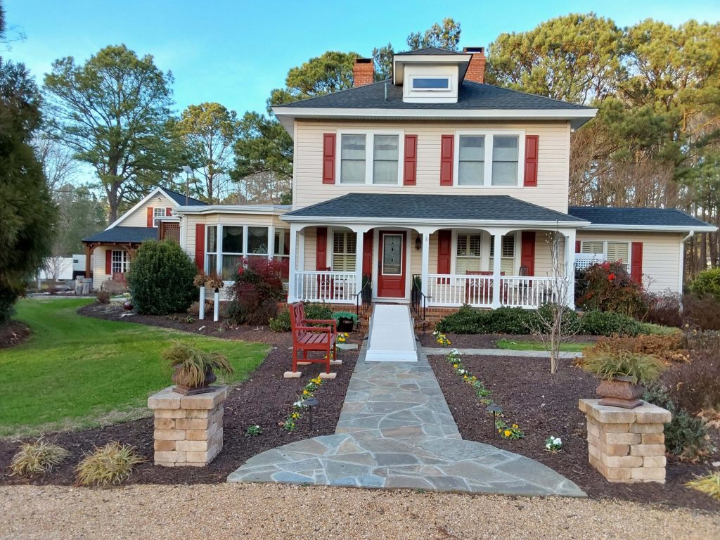 Front of home with breezeway towards the left during the day