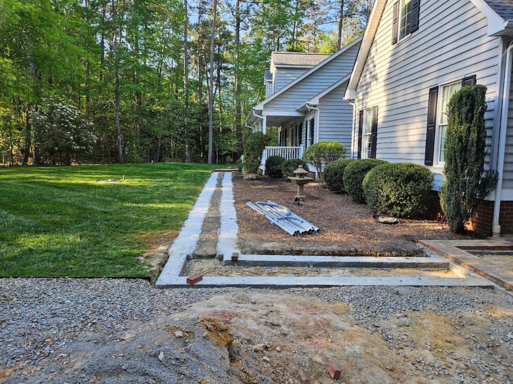 Pavers in progress from front door to garage