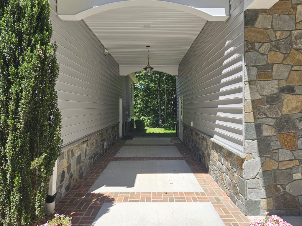 Breezeway connecting Garage Addition leading to backyard