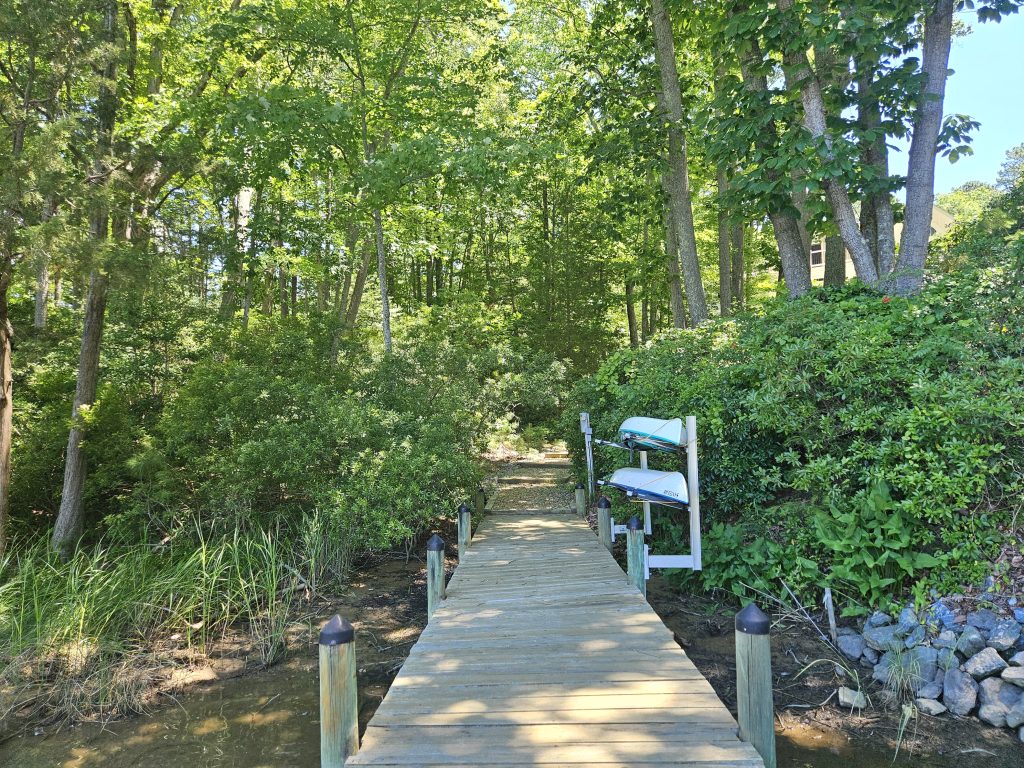 Water front dock leading to new home Addition